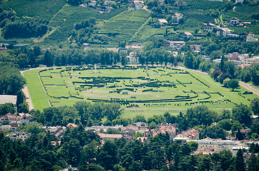 Telephoto view of Sankt Georgen on the southern slope of the Merano Valley on the horse racing track at Meran in the summer