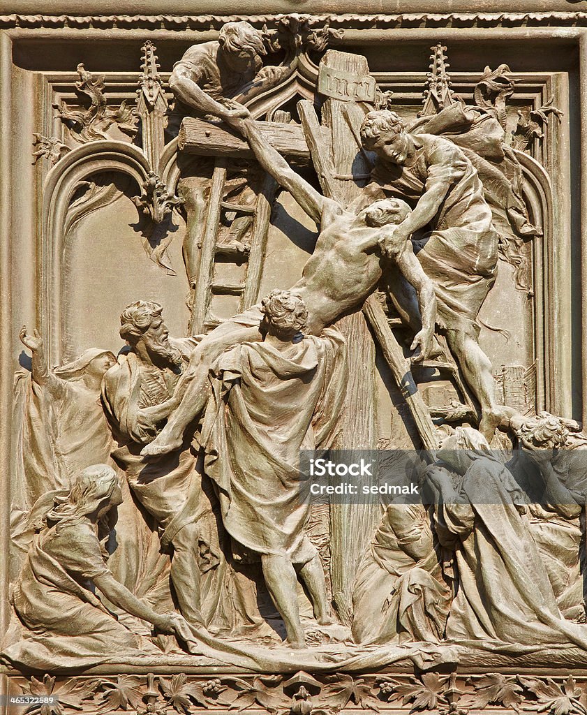 Milan - deposition of the cross on Duomo main gate Milan - deposition of the cross scene on main gate of Duomo by Ludovico Pogliaghi Abdication Stock Photo