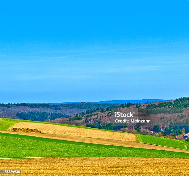 Landscape With Fields And A Village With Hills Stock Photo - Download Image Now - 2015, Agricultural Field, Agriculture