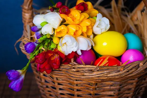 Photo of Easter eggs and freesia in basket