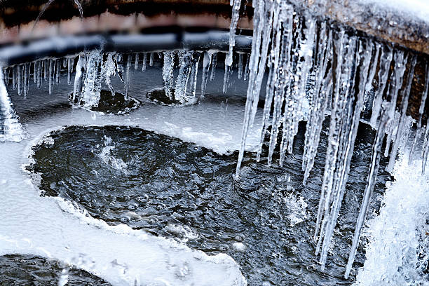istock Heart shape created by melting ice in the fountain. 465325362
