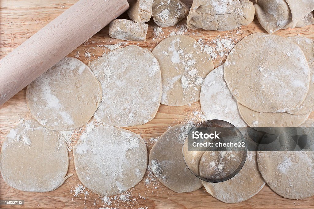 Dough for Cooking Homemade dough rolled out into circles for making potstickers. 2015 Stock Photo