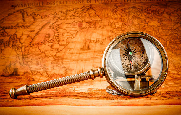 istock Vintage magnifying glass lies on an ancient world map 465327580