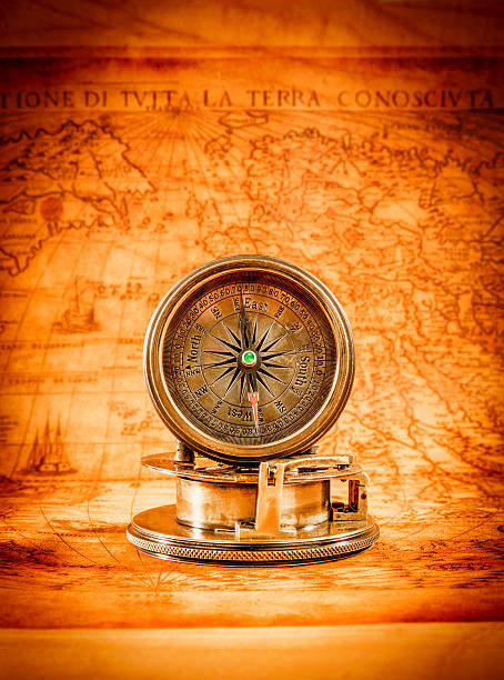 istock Vintage compass lies on an ancient world map. 465327584