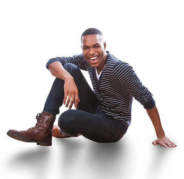 istock Young African American Man sitting on floor 465327746