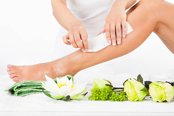istock Woman Getting Legs Waxed 465329097