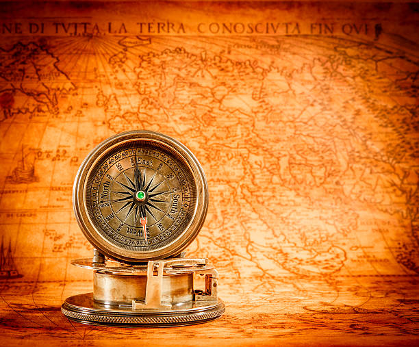 istock Vintage compass lies on an ancient world map. 465329862