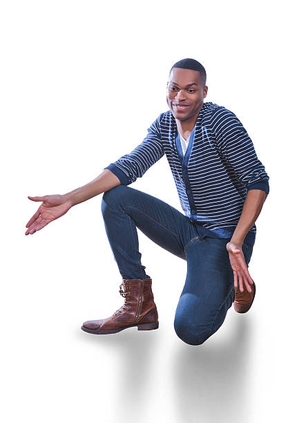 istock Young African American Man kneeling on floor 465330214