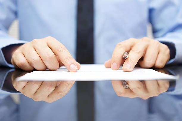 businessman is carefully reading contract