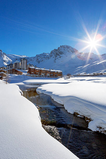 istock Tignes village with sun and creek 465331634