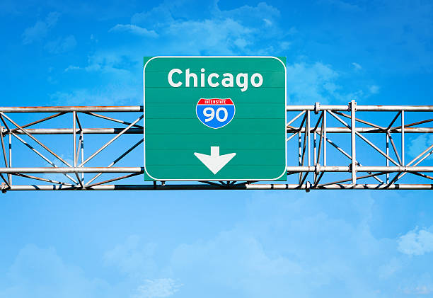 Chicago Interstate 90 Sign An elevated overhead highway sign. It reads "Chicago" and has an Interstate 90 shield above an arrow pointing downward. chicago street signs stock pictures, royalty-free photos & images