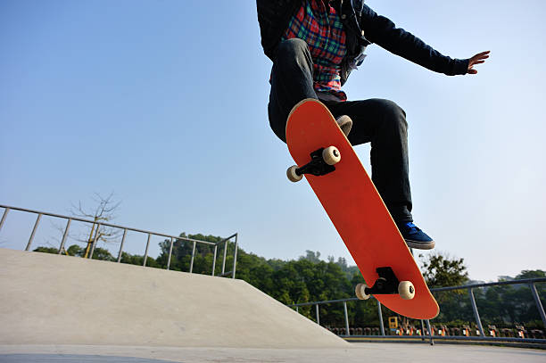 istock skateboarding  jumping at  sunrise 465335986