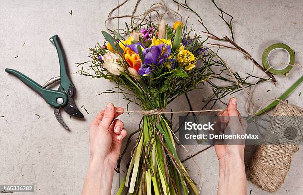 Hands Of Florist Making Bouquet Spring Flowers Stock Photo - Download Image Now - 2015, Adult, Arranging