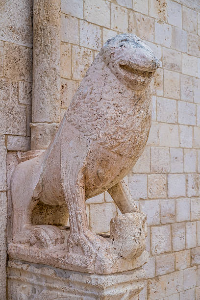 Stone lions Stone lions on the portal of the mother church in Conversano, Italy conversano stock pictures, royalty-free photos & images