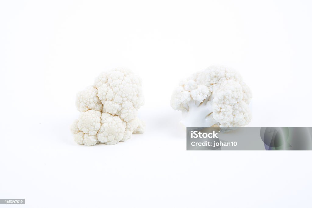Pieces of the fresh cauliflower Pieces of the fresh cauliflower on a white background. Agriculture Stock Photo