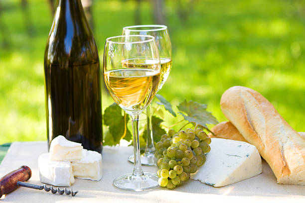 istock Two glasses of white wine and bottle 465348147