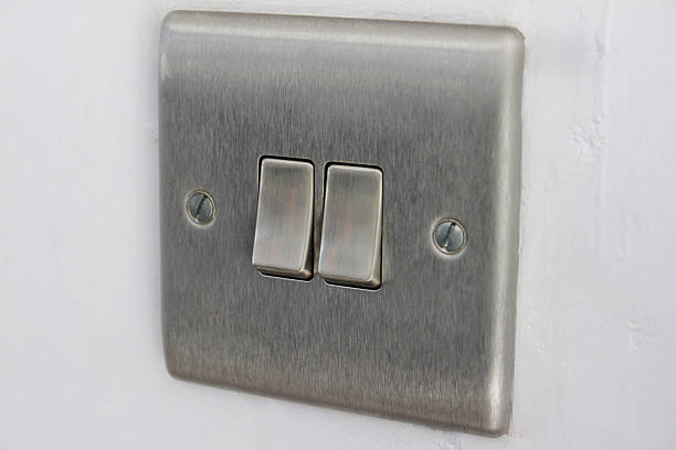 istock Image of stylish, contemporary double stainless steel light switch, square 465351046