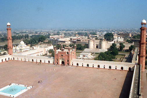 View from within walls of Badshahi Mosque toward Lahore Fort Punjab Pakistan