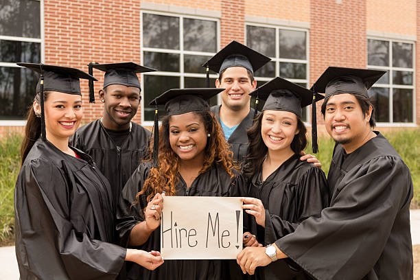 friends-hold-hire-me-sign-after-college-graduation
