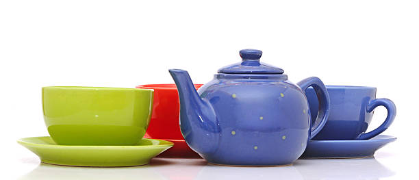 istock colorful tea cups with teapot isolated on white 465352577