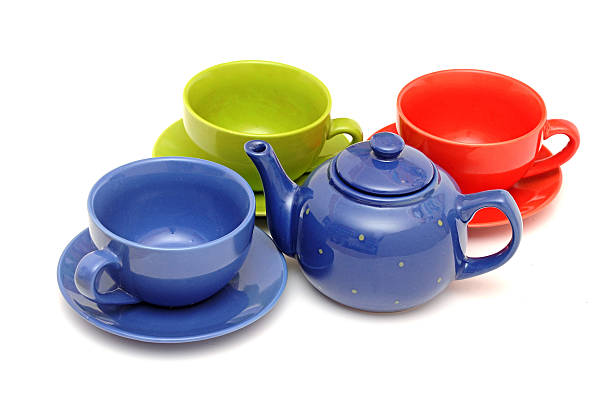 istock colorful tea cups with teapot isolated on white 465352833