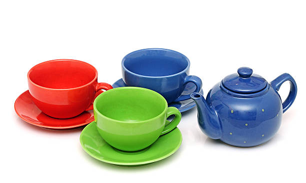 istock colorful tea cups with teapot isolated on white 465352973