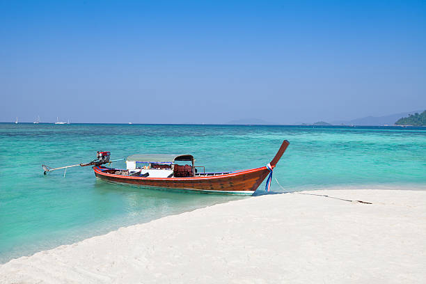 istock Long-tailed boat and beach with clear sky 465354872