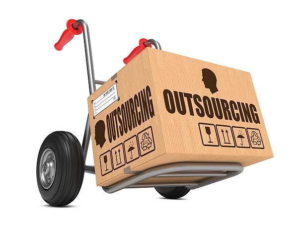 istock Outsourcing - Cardboard Box on Hand Truck. 465355481