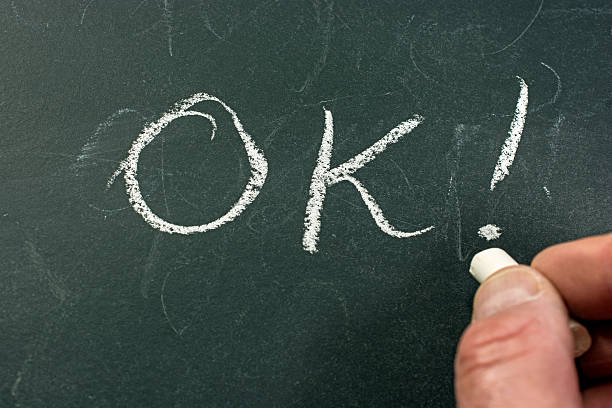 istock Hand writing on a blackboard- OK ! Close-up 465355578
