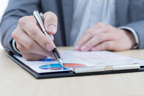 istock Businessman's hand showing financial report 465355849