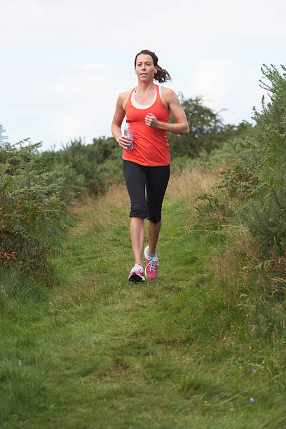 istock Woman On Run In Countryside 465357165