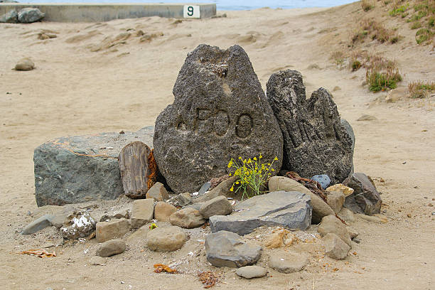 Mark Foo Memorial Stone Mavericks, California, USA - June 27, 2011: A memorial stone pays homage to the late surfing legend Mark Foo. On December 23 1994, Foo died in a surfing accident at Mavericks. mavericks california stock pictures, royalty-free photos & images