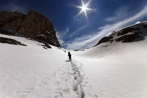 Hiker on snowmountains. Turkey, Central Taurus Mountains, Aladaglar (Anti-Taurus), plateau Edigel (Yedi Goller)