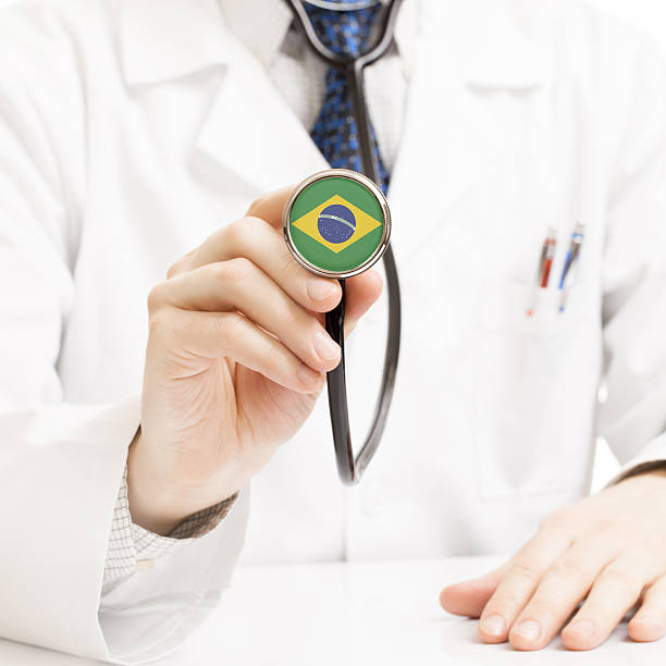 Doctor holding end of stethoscope with a Brazilian flag on stock photo