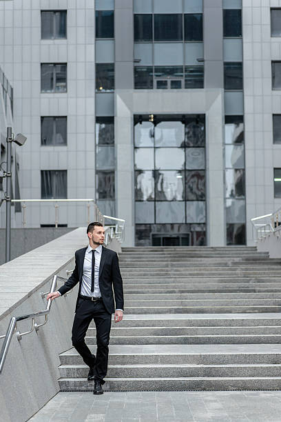 istock Strict businessman. Side view of a full-length attractive young 465363054