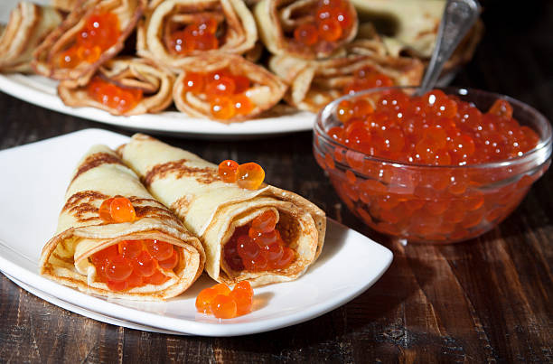 istock Red caviar salmon fish with pancakes  . 465363306