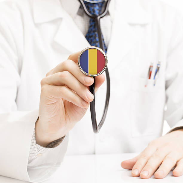 istock Doctor holding stethoscope with flag series - Romania 465364400