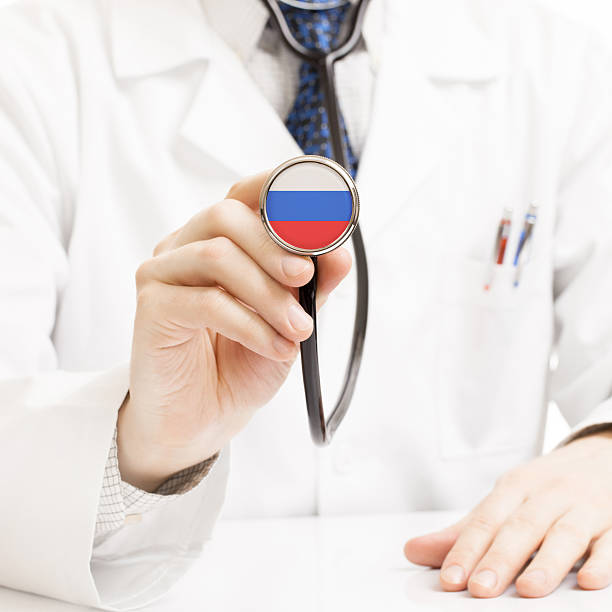 istock Doctor holding stethoscope with flag series - Russia 465364406