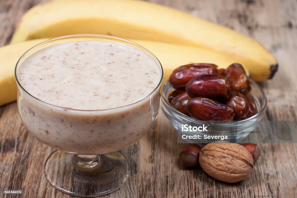 Smoothie with a banana with dates and nuts  . Smoothie with a banana with dates and nuts and yogurt. 2015 Stock Photo