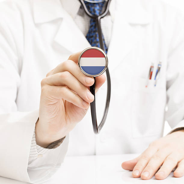istock Doctor holding stethoscope with flag series - Netherlands 465369024