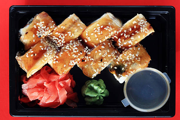 delivery service Japanese food rolls in plastic box