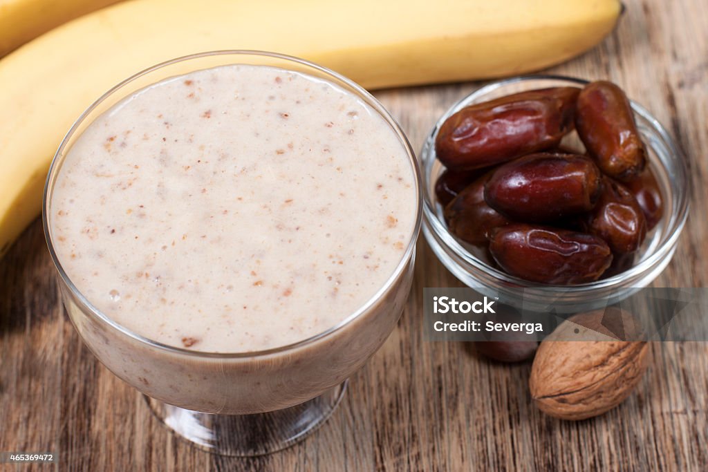 Smoothie with a banana with dates and nuts  . Smoothie with a banana with dates and nuts and yogurt. 2015 Stock Photo