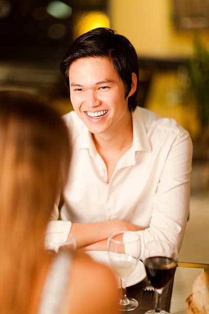 istock Happy young Asian man in a restaurant 465370784