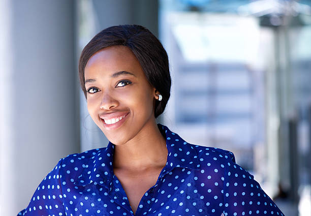 istock Friendly business woman smiling outside office building 465372936
