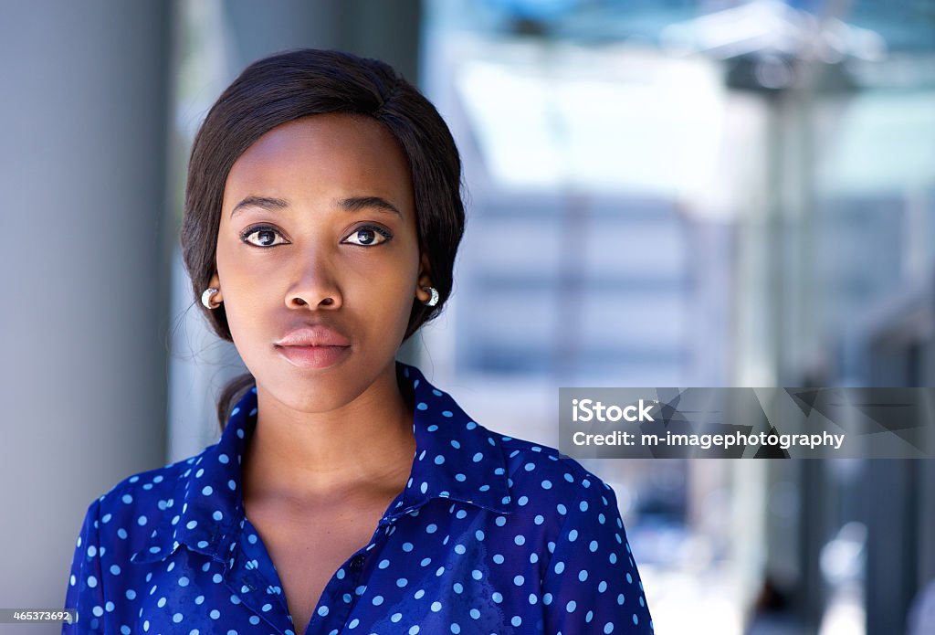 Business woman standing outside office building Close up business woman standing outside office building Serious Stock Photo