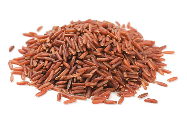 istock Pile of red rice on white background 465374782