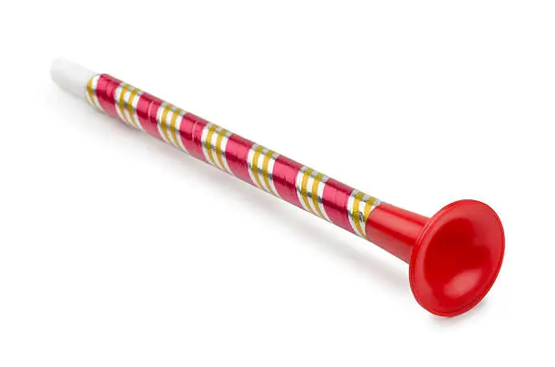 Red plastic toy horn isolated on white