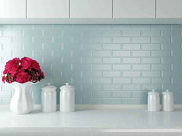 Simple yet elegant white kitchen Ceramic tableware on the worktop. White kitchen design. kitchen backsplash stock pictures, royalty-free photos & images