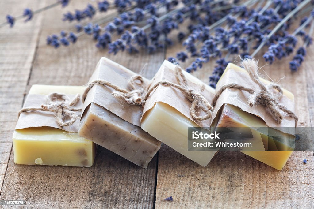 Lavander soap Lavender soap and salt on rustic wooden board. Spa concept 2015 Stock Photo