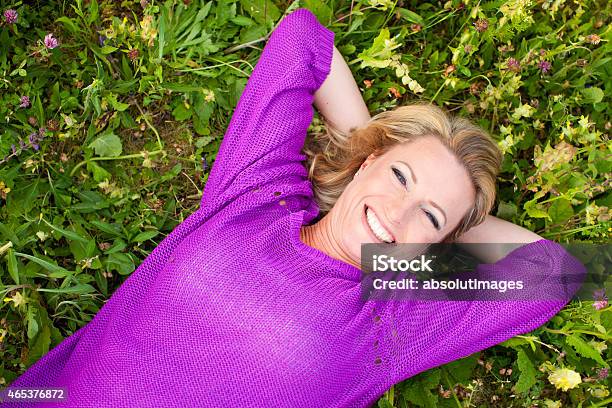 Happy Woman In Flower Field Stock Photo - Download Image Now - 2015, Adult, Horizontal